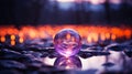 a purple crystal ball sits on the ground in front of a forest Royalty Free Stock Photo