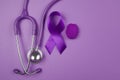 Purple day. World epilepsy day. Purple ribbon on purple background Royalty Free Stock Photo