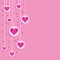 Purple decorative hanging hearts on pink background with copy space. Happy Valentine's Day celebration. Royalty Free Stock Photo