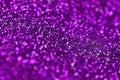 Purple decorative sequins. Background image with shiny bokeh lights from small elements Royalty Free Stock Photo