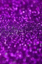 Purple decorative sequins. Background image with shiny bokeh lights from small elements Royalty Free Stock Photo