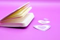 purple diary on purple background with hearts Royalty Free Stock Photo