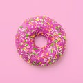 Purple donut in glaze on a pink background. Great fresh tasty pu