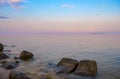 Purple Dusk. Beautiful clouds over the calm sea. Pink sunset on the sea