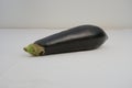 A purple eggplant on white background, a delicious and nutritious aubergine