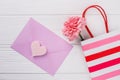 Purple envelope, shopping bag and flower.