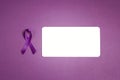 Purple epilepsy awareness ribbon with empty white card on a purple background. Copy space for text. World epilepsy day