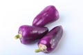 Purple exotic color bell peppers white background. Royalty Free Stock Photo