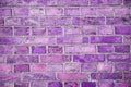 Purple fading clay brick wall, vintage look, detailed view Royalty Free Stock Photo