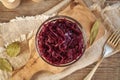 Purple fermented cabbage or sauerkraut in a glass bowl on a wooden table Royalty Free Stock Photo