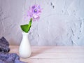 Purple flowers in vase on the table,Purple-pink flower still life on texture background or wallpaper Common water hyacinth Eichhor Royalty Free Stock Photo