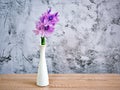 Purple flowers in vase on the table,Purple-pink flower still life on texture background or wallpaper Common water hyacinth Eichhor Royalty Free Stock Photo