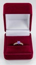 Purple Gemstone Ring with Diamonds in Maroon Velvet Box on White Background Royalty Free Stock Photo
