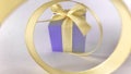 Purple gift box at the end of the spiral yellow ribbon, grey white background. Royalty Free Stock Photo