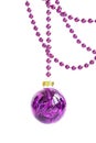 Purple glass Christmas bauble hanging on a violet bead garland Royalty Free Stock Photo