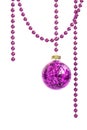 Purple glass Christmas bauble hanging on a violet bead garland Royalty Free Stock Photo