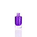 Purple glittering nail polish in glass bottle on white background isolated closeup, opened violet sequin varnish, blue lacquer