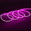 Purple glowing LED neon flex strip on black dark background Royalty Free Stock Photo