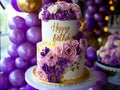 A purple and gold birthday cake with flowers Royalty Free Stock Photo