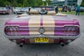 Purple and gold Classic Ford Mustang cabriolet rear view