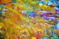 Gold paint blurred splashes, colorful vivid waxy colors, contrasts creative background Royalty Free Stock Photo