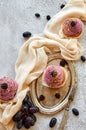 Purple golden cupcake with blackberry on vintage tray decorated with fork, light cloth, fresh blue grapes and blackberries Royalty Free Stock Photo