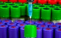 purple green red empty vacuum tubes for collecting blood samples with Royalty Free Stock Photo