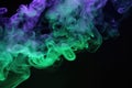 Purple green smoke black background. Color smoke. Water splash. Cosmic stardust. Royalty Free Stock Photo