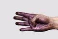 Purple Hand showing four Fingers