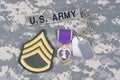 Purple Heart award with dog tags on US ARMY uniform Royalty Free Stock Photo