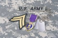 Purple Heart award with dog tags on US ARMY uniform Royalty Free Stock Photo