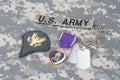 Purple Heart award with dog tags on US ARMY uniform