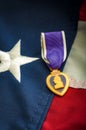 The Purple Heart medal and the American flag