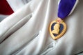 Purple Heart medal held with white gloves Royalty Free Stock Photo