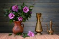 Purple hibiscus in a ceramic vase