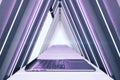 Purple interior with open laptop and luminous triangle corridor