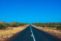 Purple iron ore dust next to road at Karijini National Park Australia