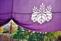 Purple Japanese temple curtain with historical emblem of Toyotomi clan. Royalty Free Stock Photo