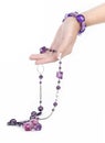 Purple jewelry and bracelet with human hand Royalty Free Stock Photo