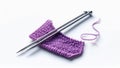 Knitting Needles and Purple Yarn on White Background Royalty Free Stock Photo