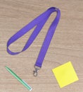 Purple Lanyard Neck Strap with metal lobster clip and green pen, note paper