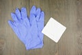 Purple latex gloves and cotton bud on tissue paper Royalty Free Stock Photo