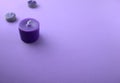 Purple, lavender candles on table. Aromatherapy, spa, massage, relaxation or improving psychological well-being concepts.