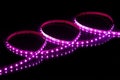 Purple LED strip tape on black background Royalty Free Stock Photo