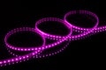 Purple LED strip tape on black background Royalty Free Stock Photo