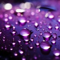 Purple light highlights close up raindrops on the windows surface