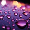 Purple light highlights close up raindrops on the windows surface