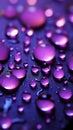 Purple light highlights close up raindrops on the windows surface