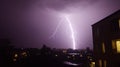 Purple Lightning Strike Over City at Night Royalty Free Stock Photo