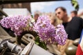 Purple lilac flowers on a vintage American armed vehicle - celebration of end of WWII in Plzen, Czech Republic